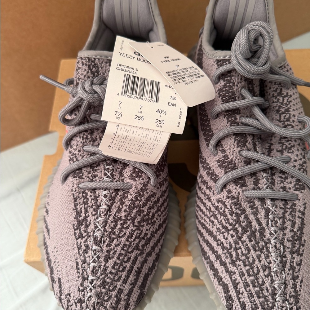Yeezy Gray and Red Sneakers with Boost Cushioning